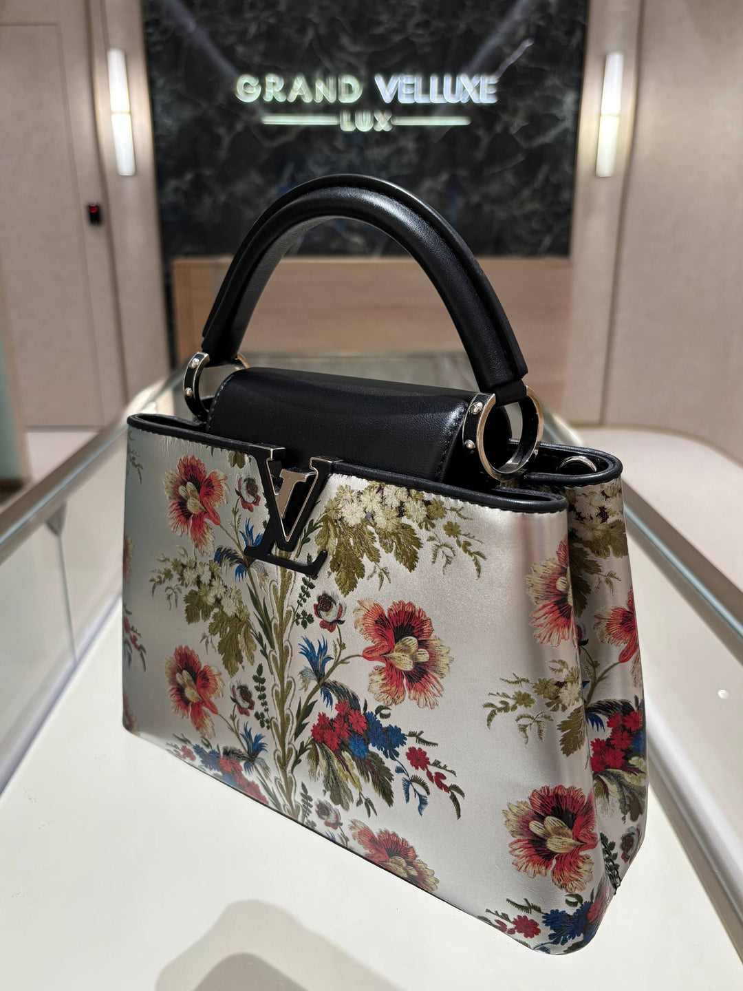 MICROCHIP LOUIS VUITTON CAPUCINES BB IN METALLIC SILVER CALFSKIN LEATHER WITH PRINTED FLORAL MOTIF