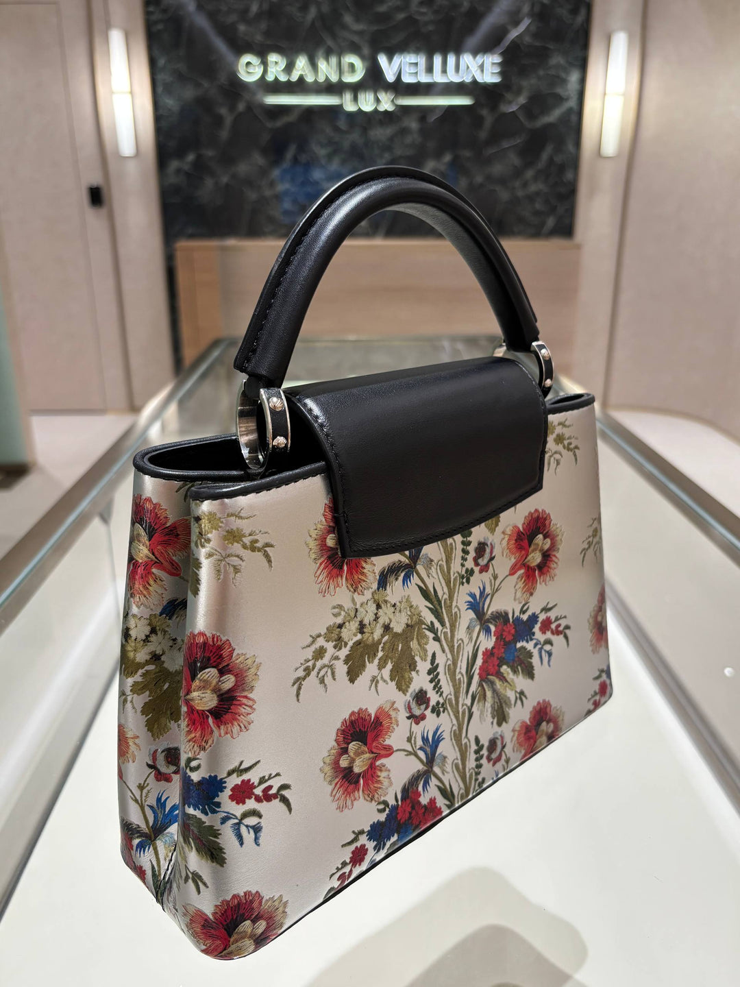 MICROCHIP LOUIS VUITTON CAPUCINES BB IN METALLIC SILVER CALFSKIN LEATHER WITH PRINTED FLORAL MOTIF