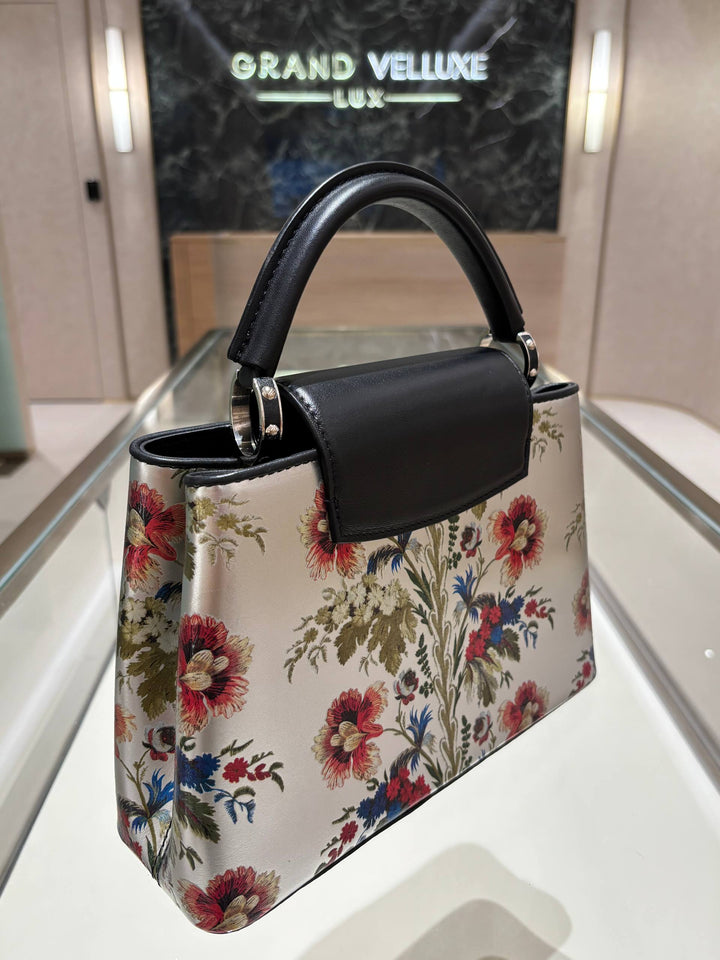 MICROCHIP LOUIS VUITTON CAPUCINES BB IN METALLIC SILVER CALFSKIN LEATHER WITH PRINTED FLORAL MOTIF