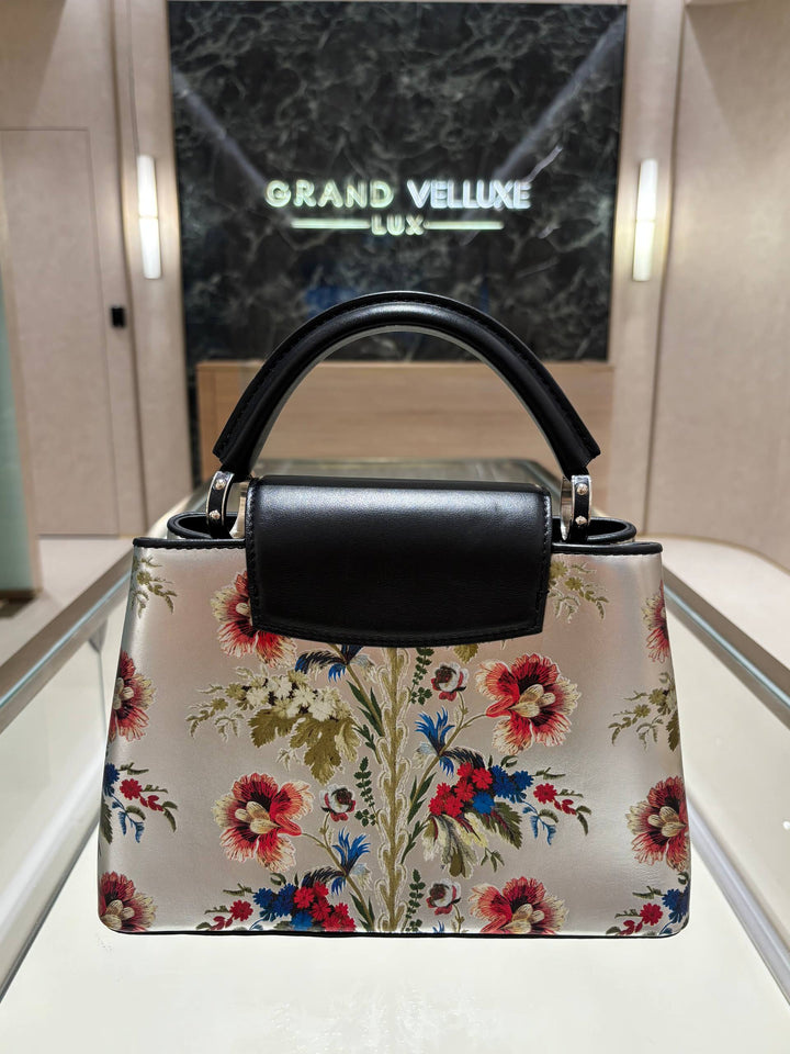 MICROCHIP LOUIS VUITTON CAPUCINES BB IN METALLIC SILVER CALFSKIN LEATHER WITH PRINTED FLORAL MOTIF